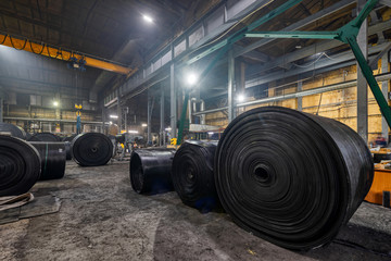 Interior of a factory for manufacturing rubber conveyor belts.