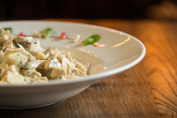 Gnocchi with turkey meat and porcini mushrooms in a cream sauce