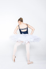 Naklejka premium Young ballerina practising ballet moves