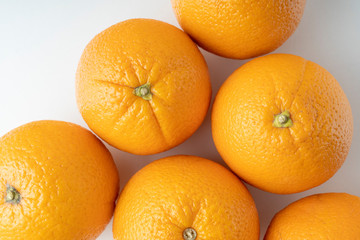 fresh oranges on a white background close up