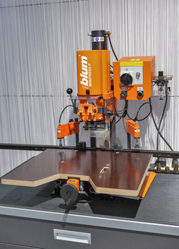 Blum press machine at KiFF furniture exhibition in Kyiv, Ukraine.