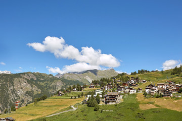 Beautiful little village surrounded by wildlife, mountains and blue sky. A quiet corner of nature.