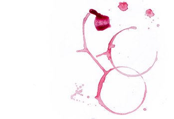 Drops and traces of red wine on white background. Concept of organic drinks. Free copy space. Tow...