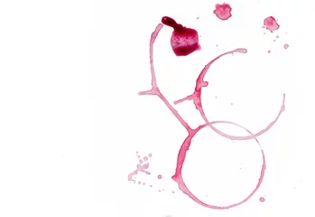 Fototapete Wein Drops and traces of red wine on white background. Concept of organic drinks. Free copy space. Tow view.  © Tatiana