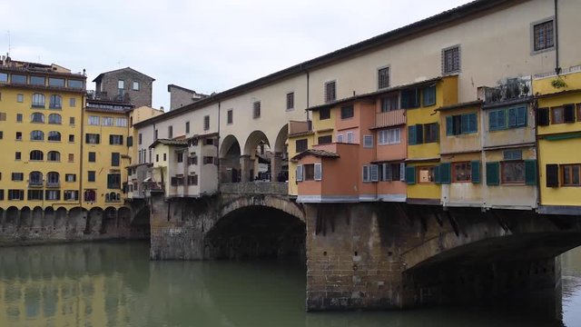 view of the old colorful bridge ponte vecchio Florence in italy during winter season