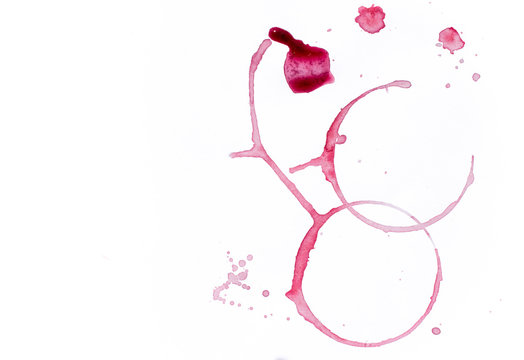 Drops and traces of red wine on white background. Concept of organic drinks. Free copy space. Tow view.
