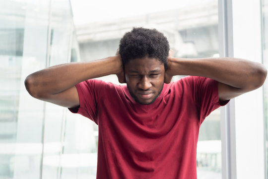 African black man covering his ears, concept of censorship, free speech limitation, news manipulation, hidden truth, secret