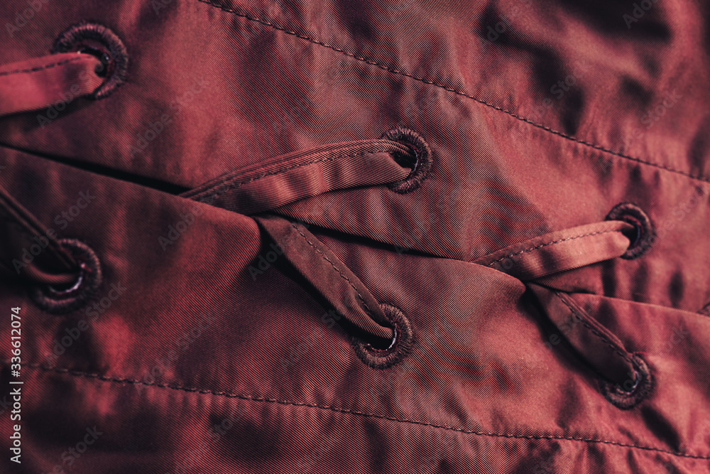 Poster Close up beautiful red textile cloth background with stitching. Macro photography background material view.