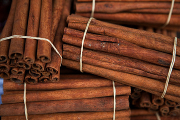 cinnamon sticks on wooden background