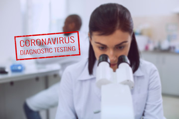 Serious young bioengineer working in the lab