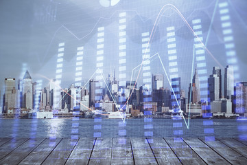 Obraz premium Forex graph on city view with skyscrapers background multi exposure. Financial analysis concept.