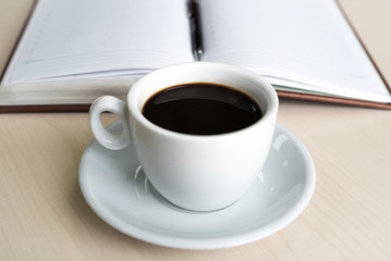 Coffee Cup on Office Table. Daily Planner. Business Concept