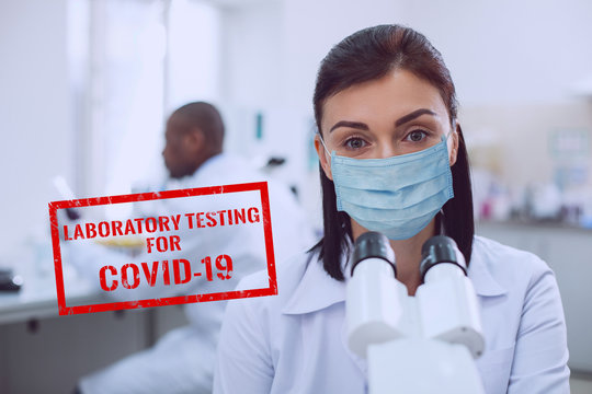 Alert female scientist styding the covid-19 virus