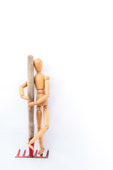 Wooden man and rake.