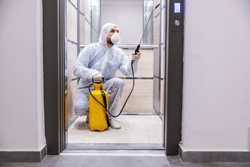 Sanitizing interior surfaces. Cleaning and Disinfection inside buildings, the coronavirus epidemic. Professional teams for disinfection efforts. Infection prevention and control of epidemic.