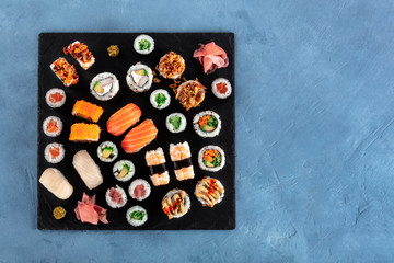 Large sushi set, shot from the top. An assortment of various maki, nigiri and rolls