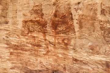 Background.Cross section of red stone rock. The mountain looks at us
