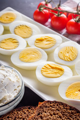 boiled chicken eggs on a dark stone background
