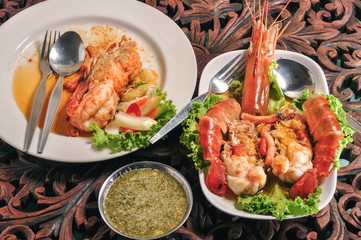River prawns fried in salt on a white plate