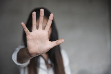 woman raised her hand for dissuade, Abuse, campaign stop violence against women. Stop sexual...