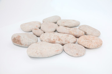 Fototapeta na wymiar Background - gray sea stones laid out on a white background