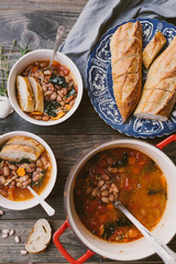homemade autumn harvest soup served with baguette