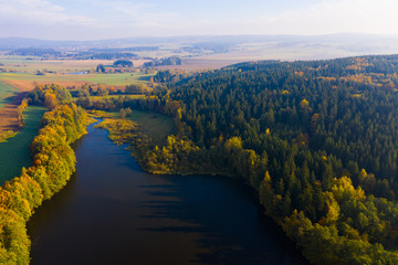 Fototapeta premium Impressive autumn landscape of trees and river
