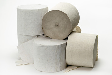 several rolls of toilet paper on the white background