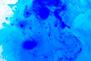 Fototapeta na wymiar Abstract blured background from blue ink, milk and oil