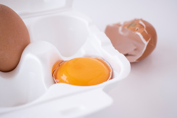 Egg yolk in white egg packaging