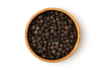Black pepper in wooden bowl on white background