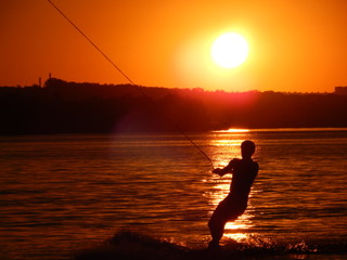 Water skiing at sunset