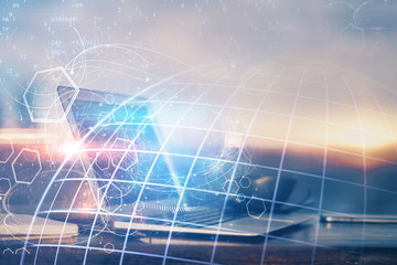 Multi exposure of table with computer and world map hologram. International data network concept.