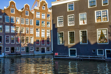Fototapeta na wymiar View on the canal and houses in Amsterdam