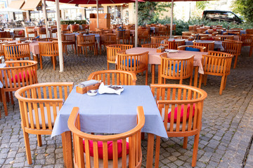 restaurant on the street without people. The interior of a summer restaurant without people. Covid-19