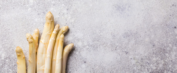 Fresh, white asparagus on a gray background. Healthy eating concept.