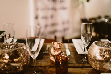 table setting with champagne flutes and gold decor