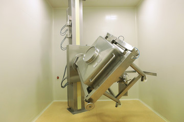 Container mixer at the factory of pharmacy. Production of tablets. A container for mixing suspensions for tablets. Automatic device for the release of a drug mixture. Innovative production of quality