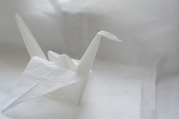 paper crane on a white paper background