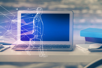 Desktop computer background in office and start up theme hologram drawing. Double exposure. Startup concept.