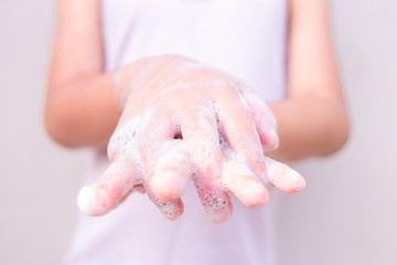 Child's hands washing their hands. Personal hygiene, cleansing the hands.
