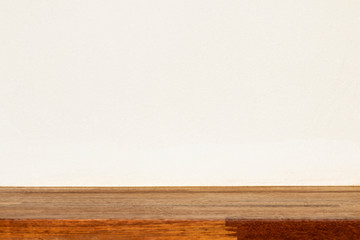 Empty wood shelf with white wall on background.