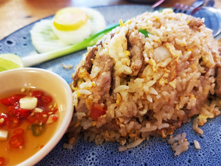 Fried Rice with Salted Beef and fish sauce in a black plate at the restaurant
