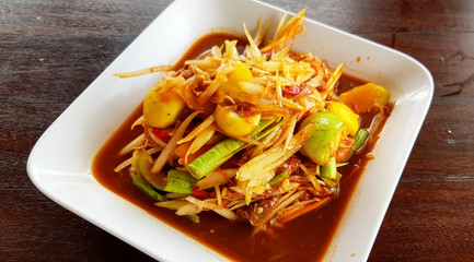 Papaya salad, pickled clams, Isan Thai food that has been very popular has a sour, salty, sweet, spicy flavor