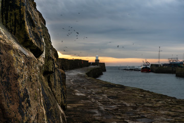 Detail of the wall with an harbor on a background