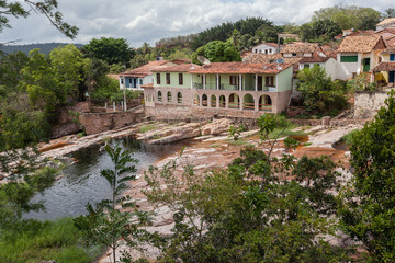 Colorful cobblestone colonial buildings Lencois riverbank city center 