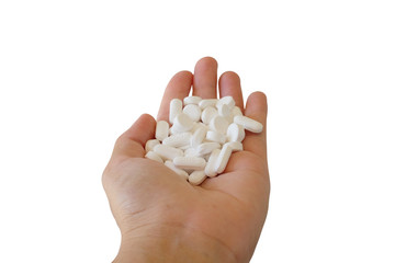 Close up a handful of medical tablets in palm hand. Paracetamol 500 mg. Medicine concept. 