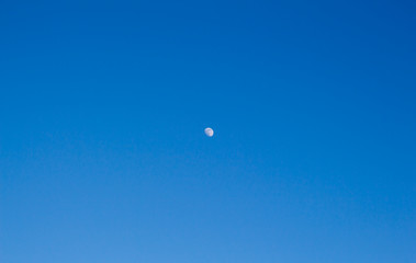 moon in the sky during the day