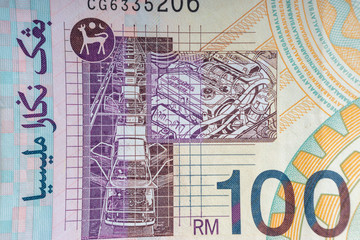 Hundred Malaysia Ringgit MYR or 100 Malaysia Ringgit Cash Banknotes macro view. Selective focus, crop fragment and Business Concept.