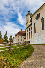 Fototapeta na wymiar Famous Pilgrimage Church Wieskirche and green lawn view in Bavaria, Germany.